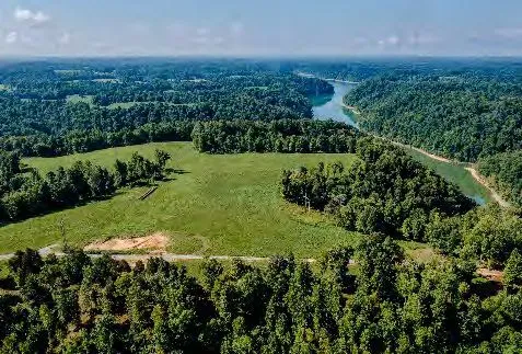 Kentucky Kabins — aerial view of wooded land and the Green River